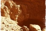 Cave in Narrow Rocky Canyon